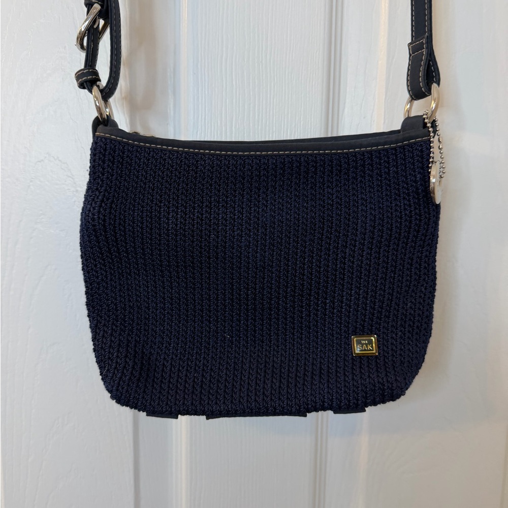 The Sak Navy Crochet Crossbody with Strap and Gold Accent